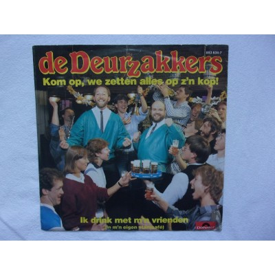 De Deurzakkers - Kom op we zetten alles op zijn kop
