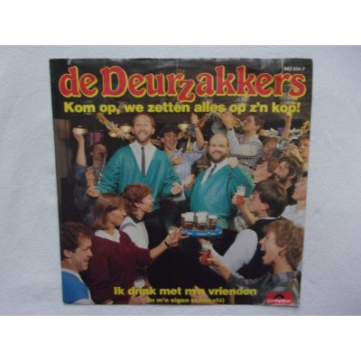 De Deurzakkers - Kom op we zetten alles op zijn kop