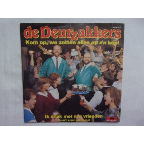 De Deurzakkers - Kom op we zetten alles op zijn kop